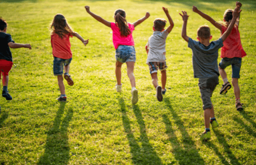 children running on the grass