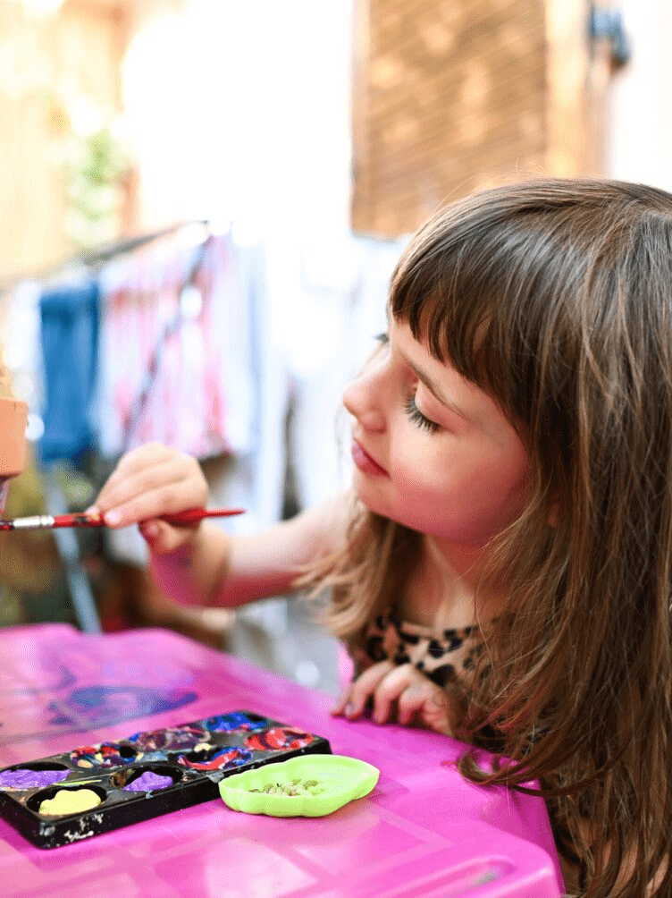 A girl painting a picture.