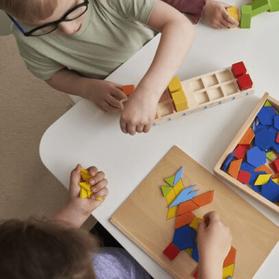 Children playing with colourful puzzle pieces.